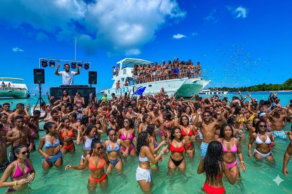 Guests enjoying a DJ-led party boat on the water